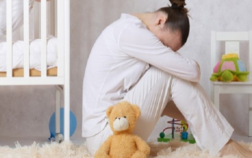 ما هي أعراض اكتئاب ما بعد الولادة؟